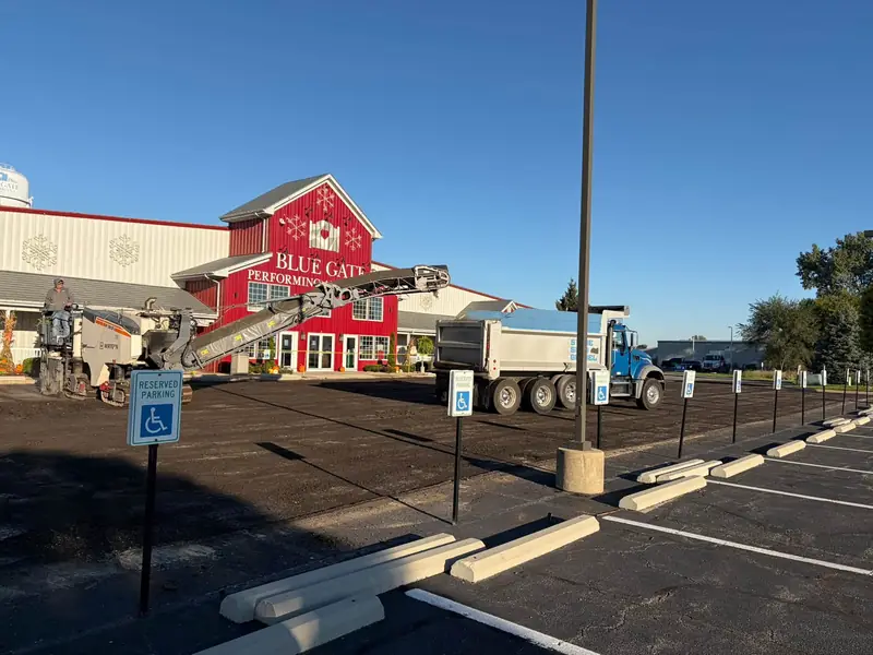 Milling the old parking lot surface at the Blue Gate Performing Arts Center before repaving