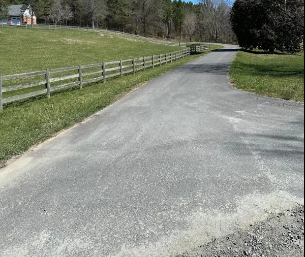 Faded, oxidized asphalt driveway before sealcoating